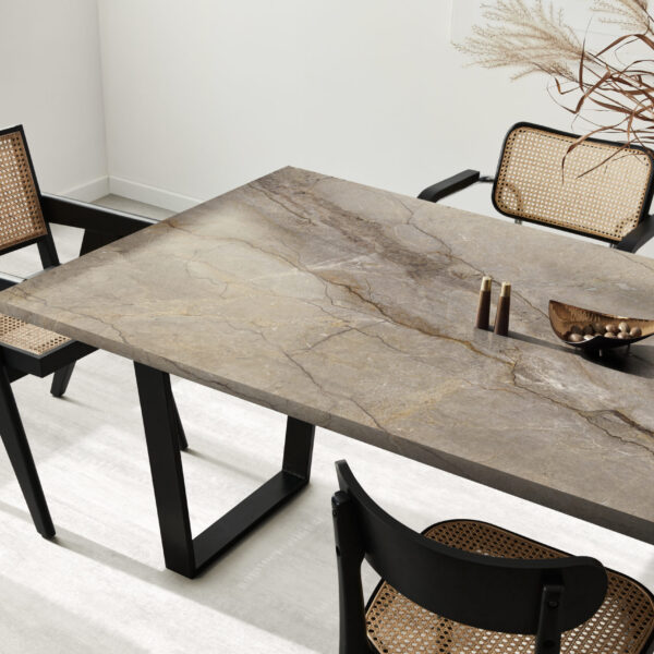 Interior design of stylish dining room interior with family wooden table, modern chairs, plate with nuts,  salt and pepper shakers. Concrete floor. White wall. Template.