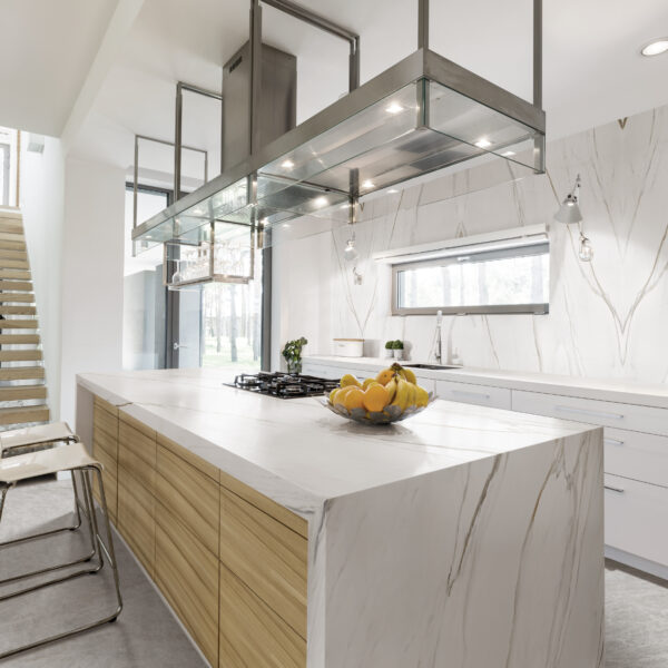 Modern open plan kitchen area with wooden and metal detail in decoration